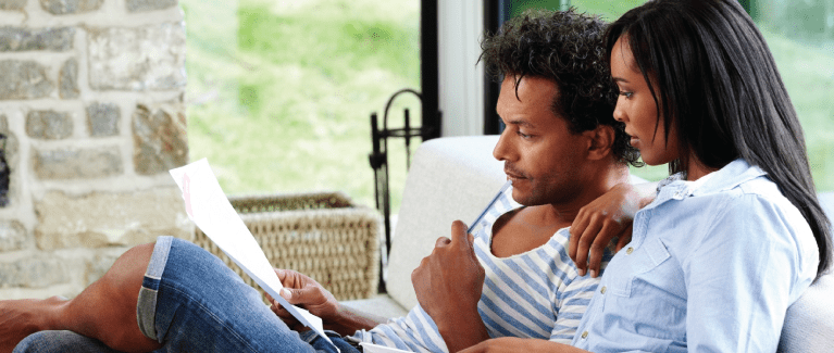 Man and woman reviewing documents.