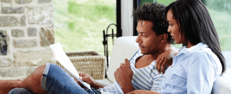 Man and woman reviewing documents.