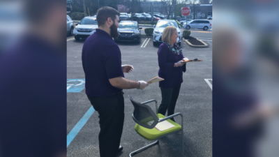 Two WSFS Associates providing parking lot banking service.