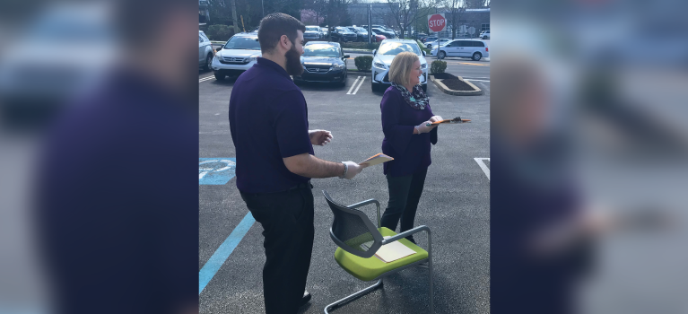 Two WSFS Associates providing parking lot banking service.