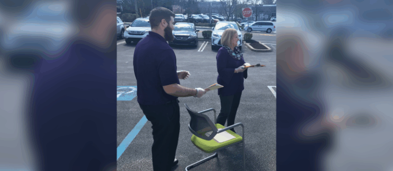 Two WSFS Associates providing parking lot banking service.