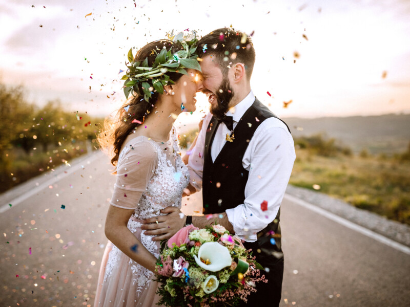 A bride and groom kissing.