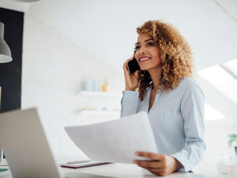 Business woman comparing savings accounts on her laptop.